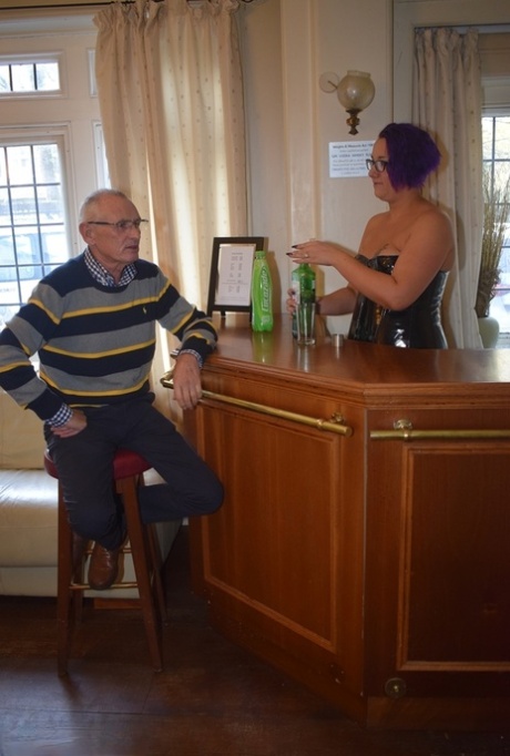 Older woman with short dyed hair lets a widowed pensioner feel her up