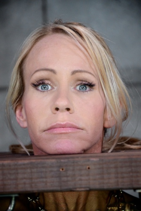 Blonde female Simone Sonay is rendered helpless in a basement dungeon
