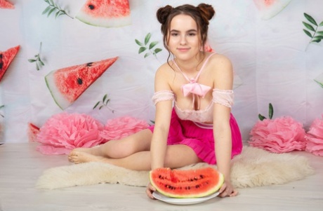 Charming young girl Wendy uncovers her full breasts while getting bare naked