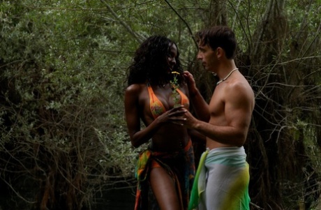Hot black girl has her firm tits & bubble butt freed from a bikini near water