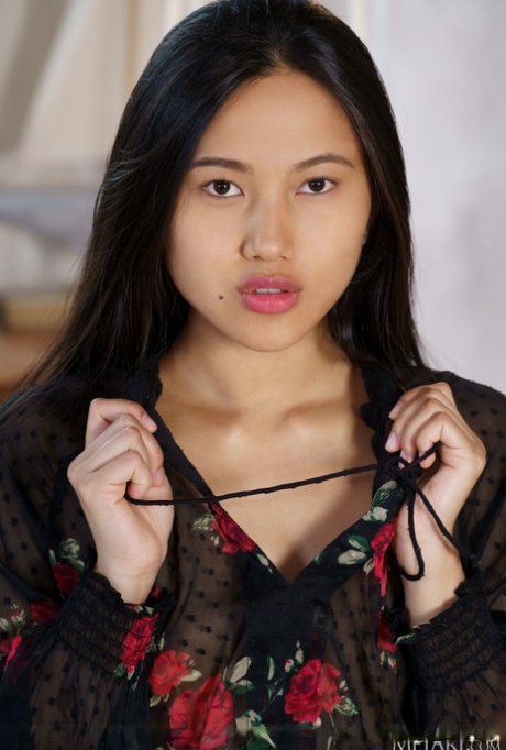 Asian teen May Thai removes her dress and heels to model totally naked