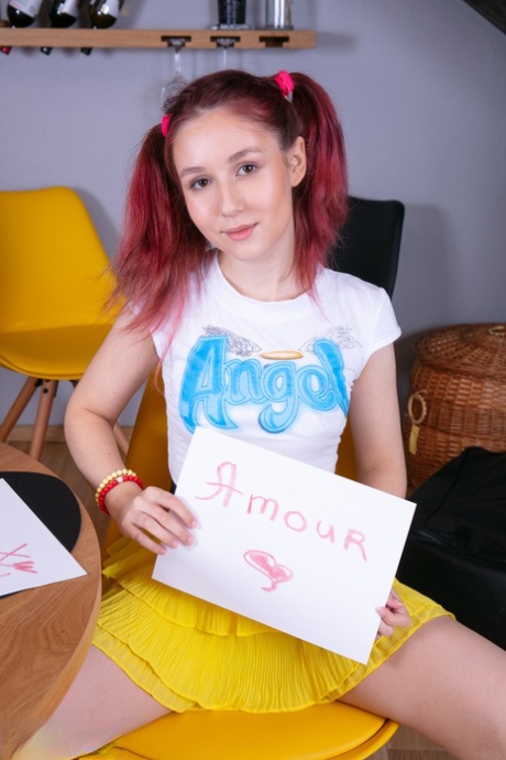 Young looking redhead uncups her tiny tits before showing her tight slit