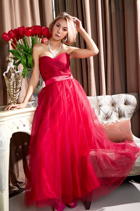 Asian beauty Pricilla exposes her hairless pussy while wearing an elegant gown