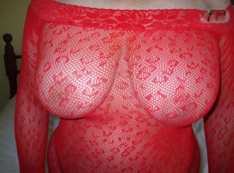 Mature amateur Busty Bliss models sheer lingerie before tugging on a cock