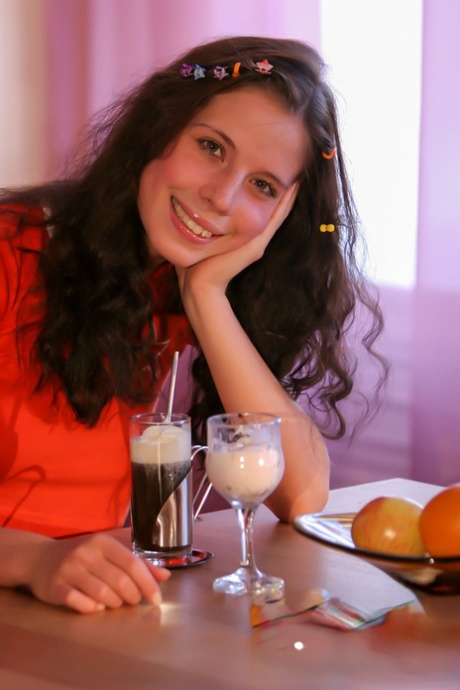 Barely legal girl Anoushka E exposes herself while eating desserts