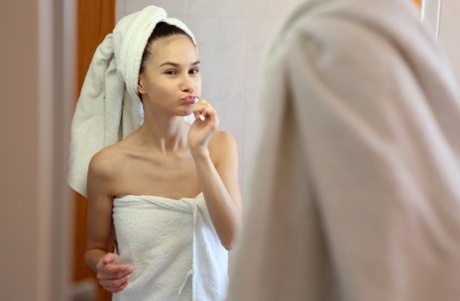 Skinny teen Leona Mia removes bath towels before great nude poses