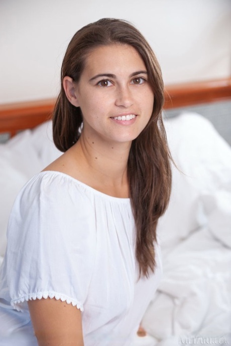 Sweet teen Nina Sphinx sets her great body free on top of her bed