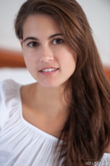 Sweet teen Nina Sphinx sets her great body free on top of her bed