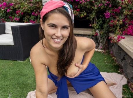 Girl next door type with big boobs Nina Sphinx gets naked in a backyard