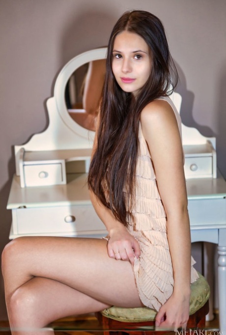Beautiful British girl Vanessa Angel gets naked while wearing footwear