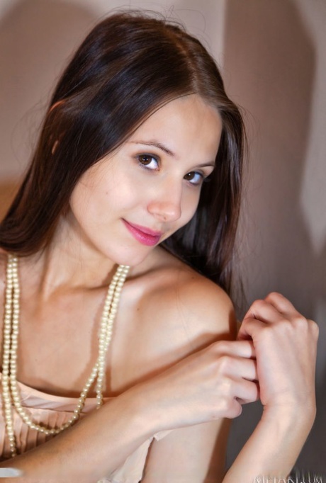 Beautiful British girl Vanessa Angel gets naked while wearing footwear