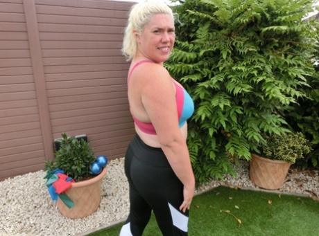 Chubby blonde lady Barby gets naked while exercising in her backyard