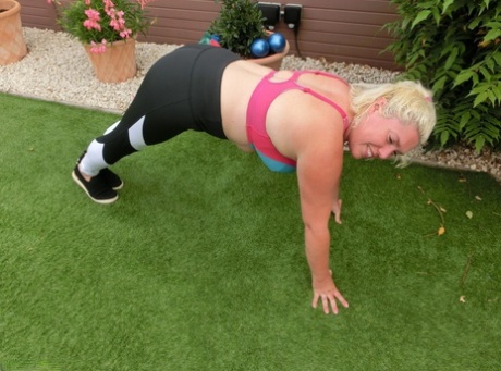Chubby blonde lady Barby gets naked while exercising in her backyard