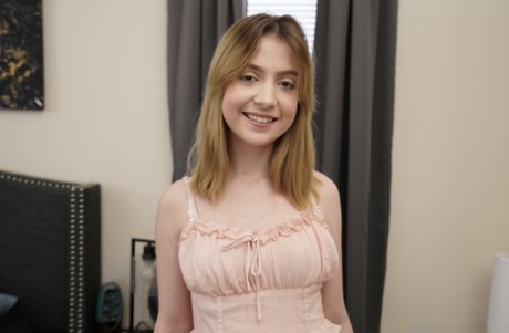 Petite amateur engages in POV sex with a long white cock on a bed