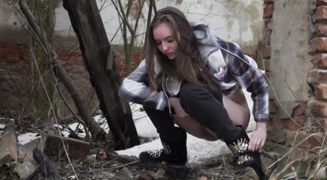 Nice girl Vika Lita gets caught with her pants down while peeing on the snow