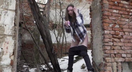 Nice girl Vika Lita gets caught with her pants down while peeing on the snow