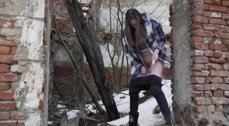 Nice girl Vika Lita gets caught with her pants down while peeing on the snow