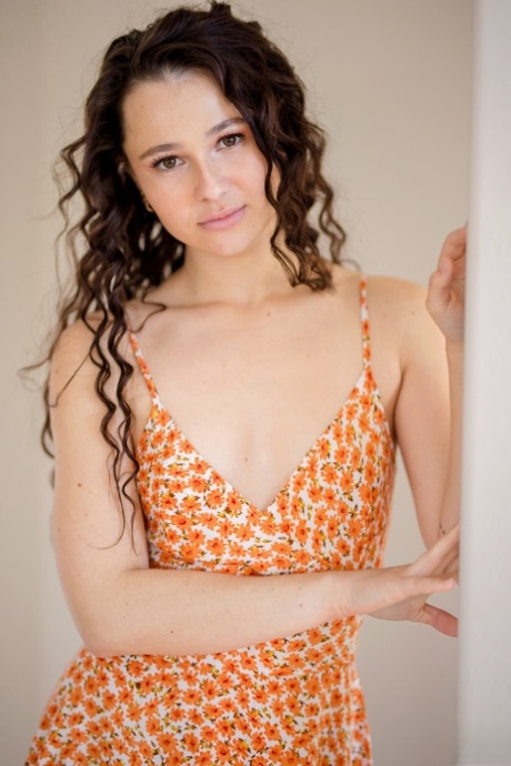 Brunette teen Liz Jordan plays with her wavy hair before fucking
