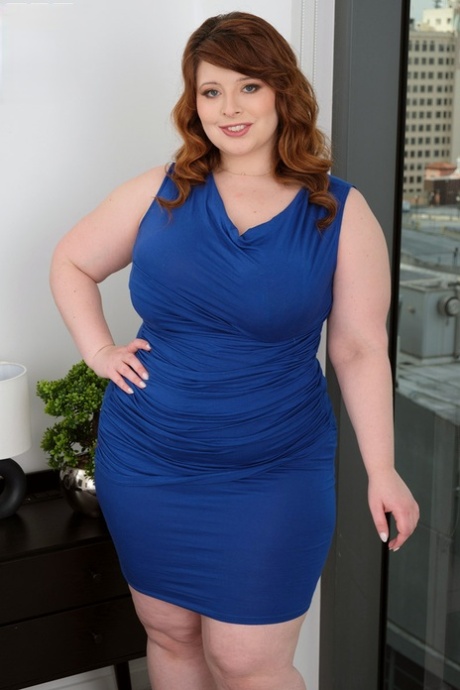Redheaded BBW Bea York is stripped naked before sex on a bed