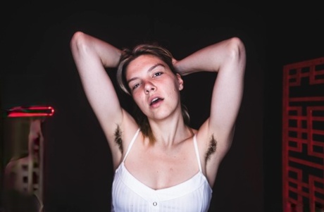Horny teen Mischa Wren shows her hairy underarms and bush while masturbating
