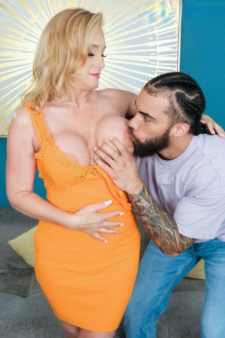 Big titted mature woman Wendy Raine has sex with a younger black man