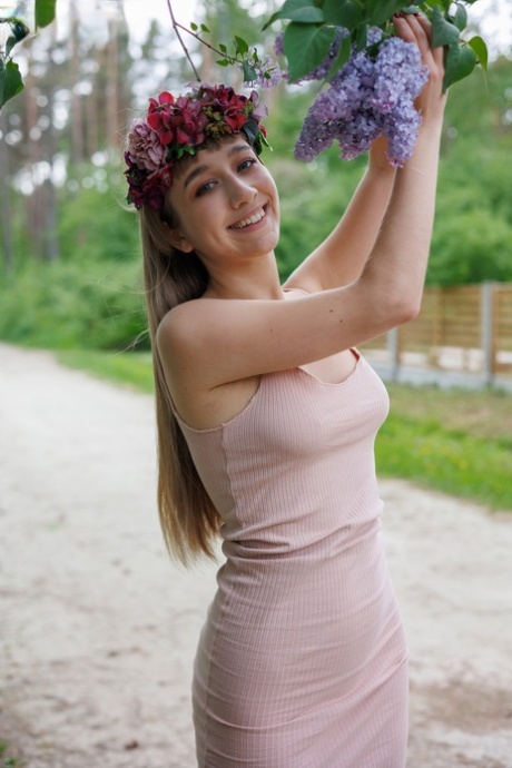 Nice teen Arete releases her great body from a dress during solo action