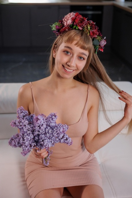 Nice teen Arete releases her great body from a dress during solo action
