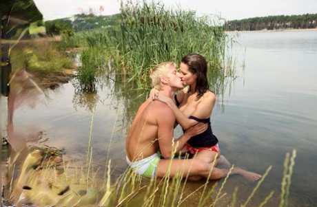 Busty teen and her boyfriend come ashore to continue the fuck fest at the lake