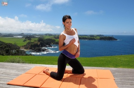 Sexy flexible Lexa doffs yoga pants to stretch pussy & bare firm ass outdoors