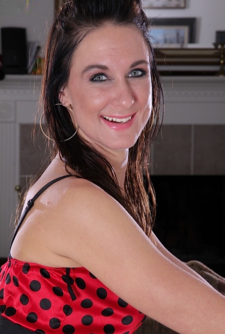 Sassy MILF in stockings undressing and teasing her pierced gash