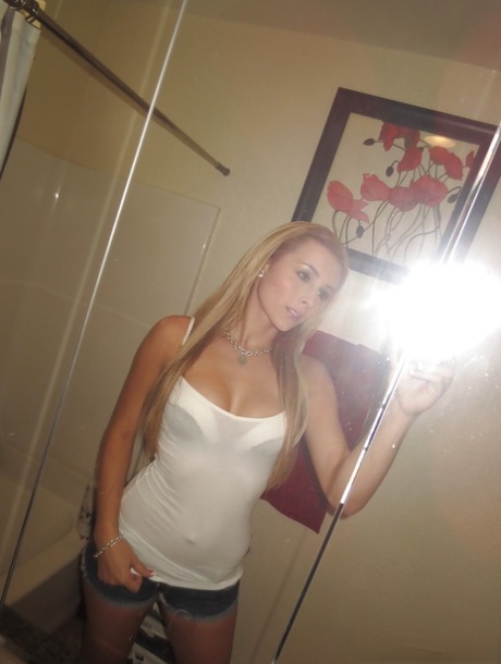Beautiful blonde slut Nikki loves self shot undressing