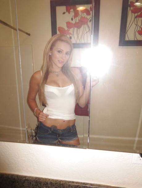 Beautiful blonde slut Nikki loves self shot undressing