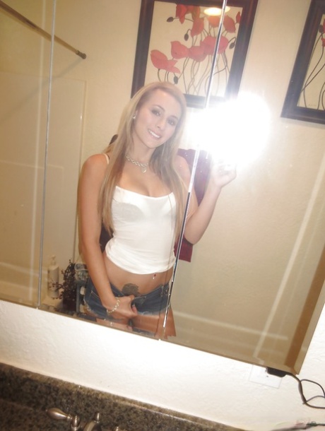 Beautiful blonde slut Nikki loves self shot undressing