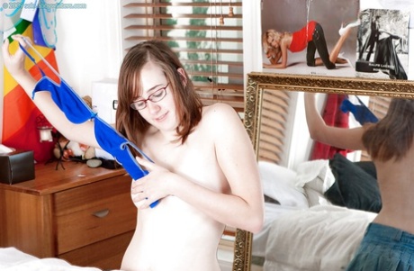 Barely legal amateur Jemma H removes skirt in bedroom to flash hairy pussy