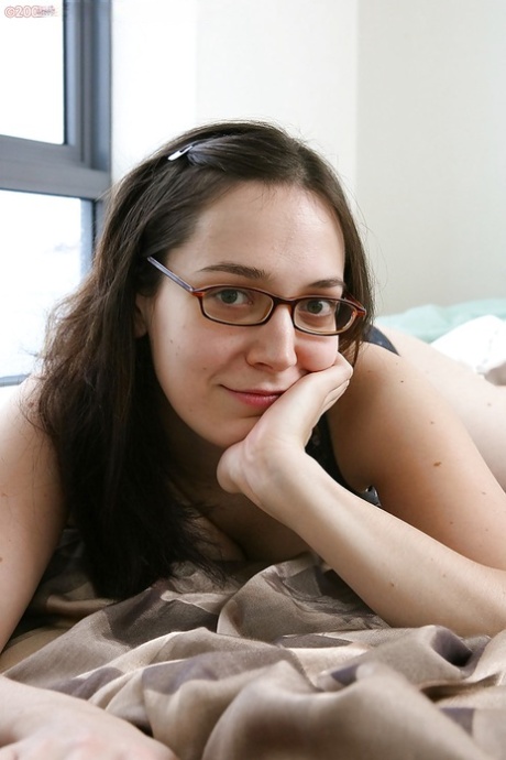 Nerdy brunette amateur Gabrielle bends over for hairy cunt spreading