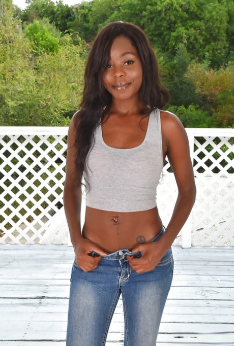 Black babe in denim jeans stripping naked to reveal phat black ass outdoors