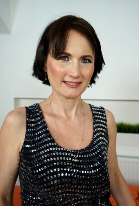 Short haired granny Alice Sharp bares her saggy tits as she strips naked
