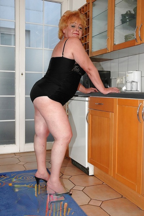 Fatty granny on high heels spreading her ass to show her tight holes
