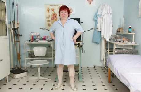Fatty granny with flabby jugs and hairy muff taking off her nurse uniform