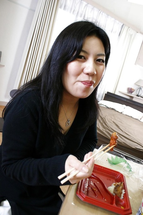 Smiley asian mature lady undressing and teasing her hairy gash