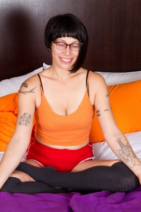 Brunette mature with hairy armpits Saffron flaunts her bush in a solo
