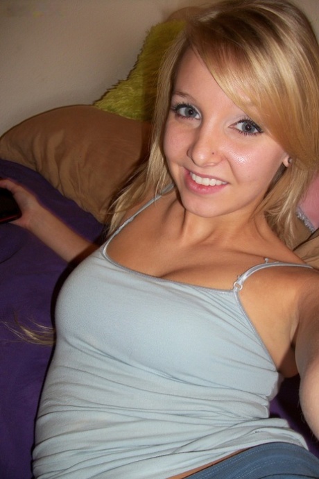 Naturally busty Elle strips in her bedroom and reveals her yummy pink holes