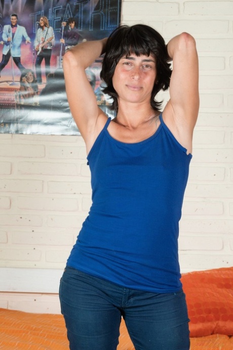 Kinky amateur Soledad shows her tiny titties and rubs her hairy beaver