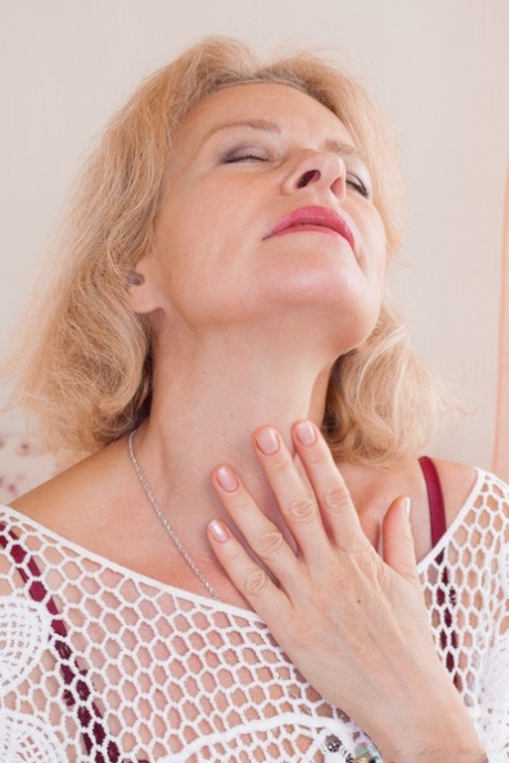 Russian granny Diana Douglas spreading and fingering her fuzzy pussy