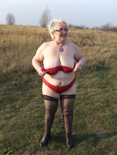 Wild granny with huge saggy tits Silke poses in lingerie & masturbates outside