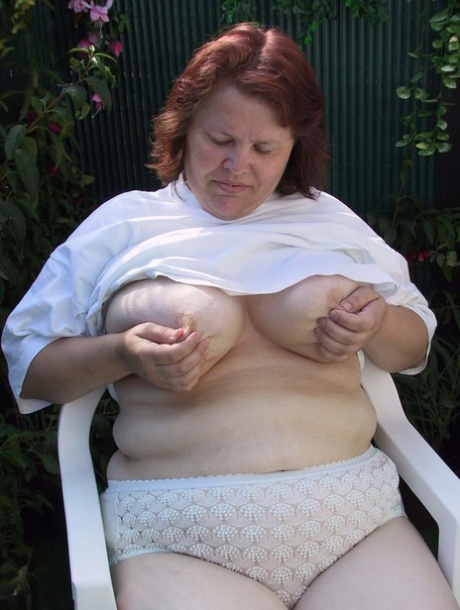 Redhead BBW Berta takes a huge toy up her mature pussy and milks a cock