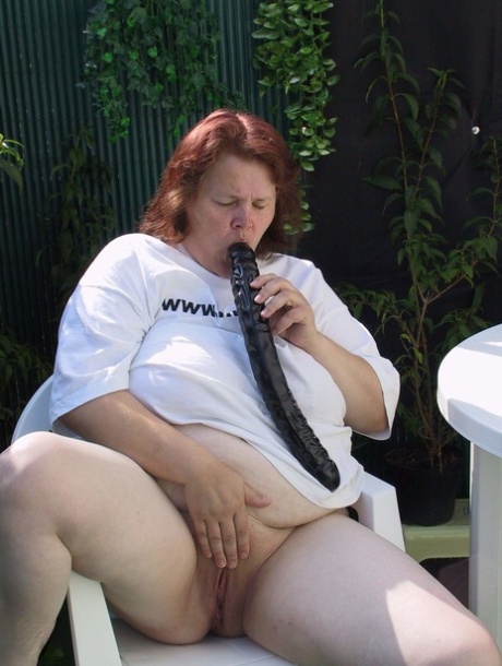 Redhead BBW Berta takes a huge toy up her mature pussy and milks a cock