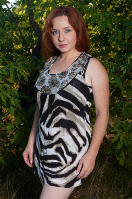 Amateur redhead Elouisa plays with her fuzzy mature pussy & big tits in nature