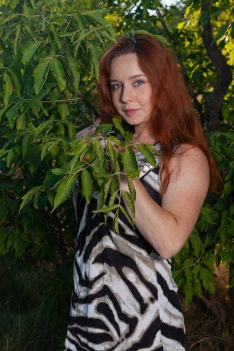 Amateur redhead Elouisa plays with her fuzzy mature pussy & big tits in nature