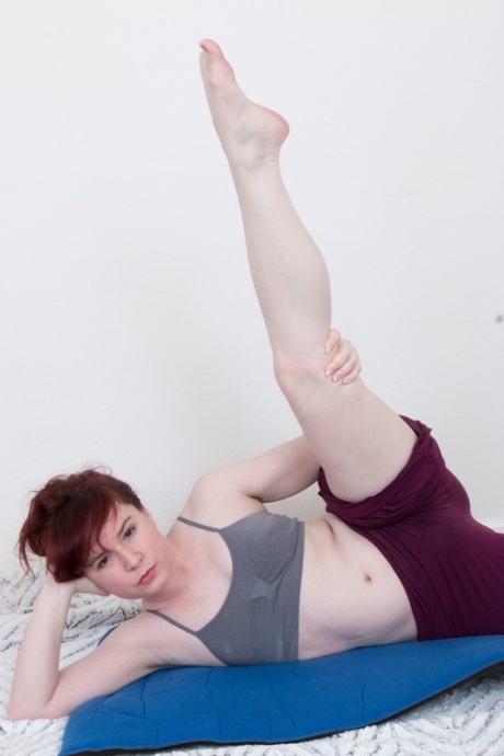 Pale redhead Annabelle Lee doffs workout clothes to show hairy armpits & muff
